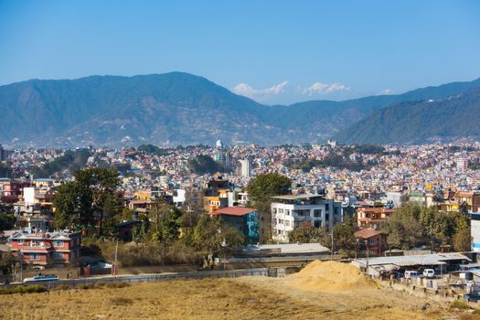 Part of Kathmandu city as seen from a vantage point, Nepal. Hills and mountains in the background.