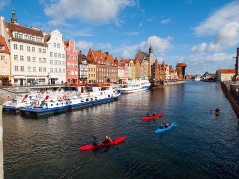 Motlawa river with many kayakers in Gdansk, Poland.