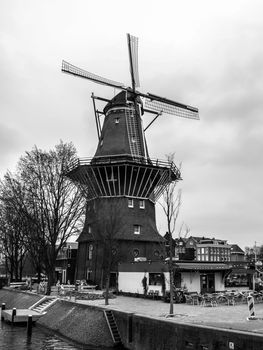 De Gooyer Windmill - old wooden mill in the centre of Amsterdam, Netherlands. Black and white image.