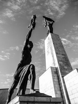 Bottom view of Liberty Statue on Gellert Hill in Budapest, Hungary, Europe. Black and white image.