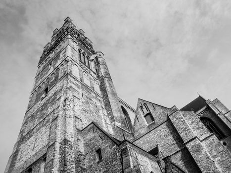 Bottom view of high tower of St. Salvator's Cathedral in Bruges, Belgium. Black and white image.