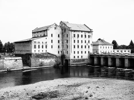 Old mill at Ohre river in Terezin, Czech Republic. Black and white image