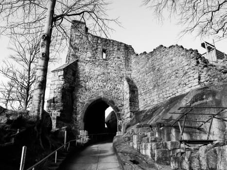 Old entrance gate to the castle ruins, Oybin, Germany. Black and white image.