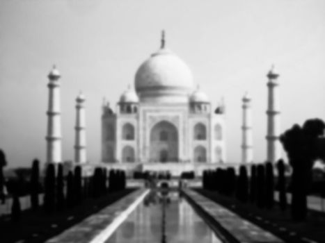 Taj Mahal mausoleum in Agra, India. Blurred black and white image.