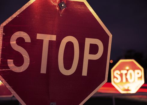 Close up of a red and white road stop sign.