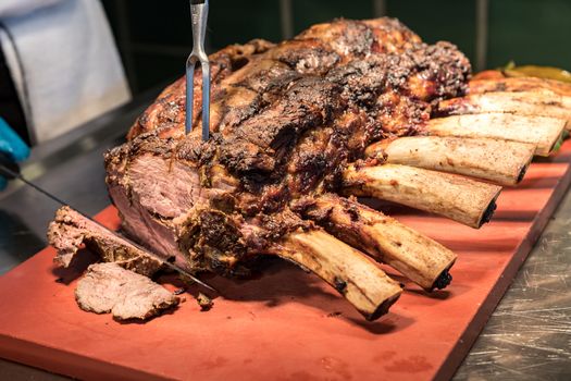 Chef Carving prime rib of  roast Wagyu beef 