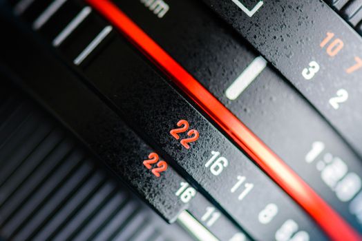 Macro shot of a camera lens focusing on camera lens information.