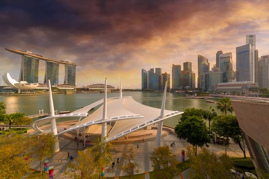 Singapore city skyline with Central Business District by Marina Bay during a cloudy sunset day