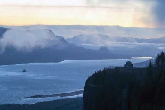 Early morning foggy dawn view of Crown Point and Beacon Rock along Columbia River Gorge between Oregon and Washington State