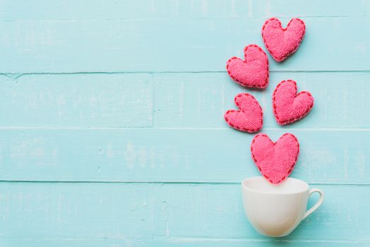 Top view  of handmade pink and red heart on blue and white color wooden background with pastel vintage style. Broken hearted, Love, Wedding and Valentines day concept.