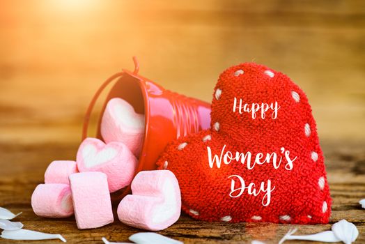 8 March Happy Women's Day message on wooden background with handmade red heart and Marshmallow in a red bucket. Womens Day concept.
