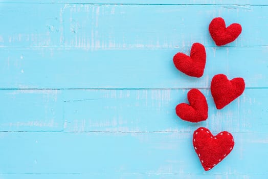 Top view  of handmade pink and red heart on blue and white color wooden background with pastel vintage style. Broken hearted, Love, Wedding and Valentines day concept.