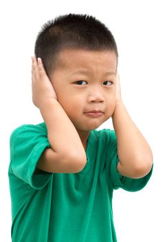 Asian child covering his ears. Portrait of young boy isolated on white background.