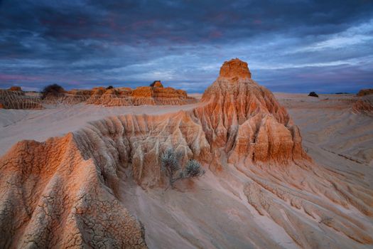 Desert sculpted sand and clay eroded over time in the dry inland of outback Australia