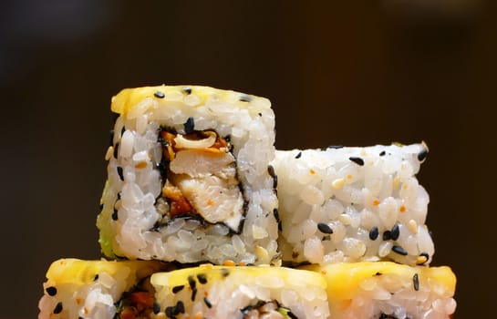 sushi rolls with sesame seeds and cheese