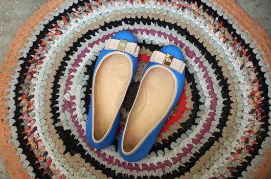 Turquoise women's shoes - "court shoes" on an old rug