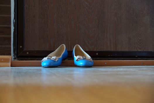 Turquoise women's shoes - "court shoes" on an apartment threshold
