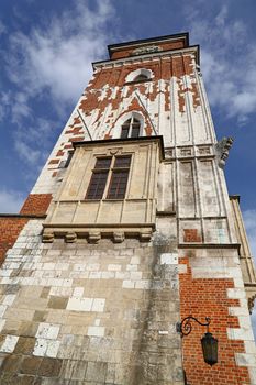 Low angle view of Town Hall tower at Main Market Square of Krakow, Poland