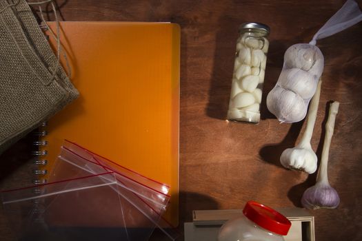 Varied garlic package on a wooden background