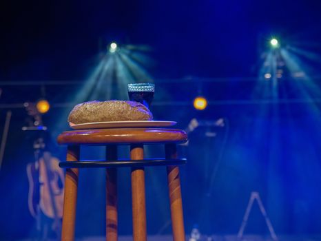 table in a church with holy supper bread and wine, the body of christ