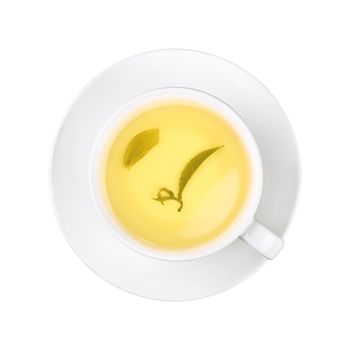 Close up one full white cup of green oolong tea with leaf, on saucer isolated on white background, elevated top view, directly above