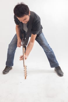 young man jumping with electric guitar on white background