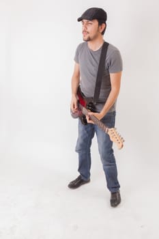 young man jumping with electric guitar on white background