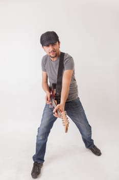 young man jumping with electric guitar on white background