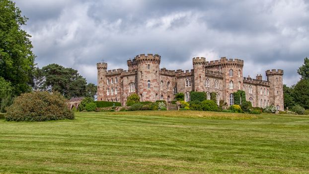 Country landscape showing an english castle standing in its grounds