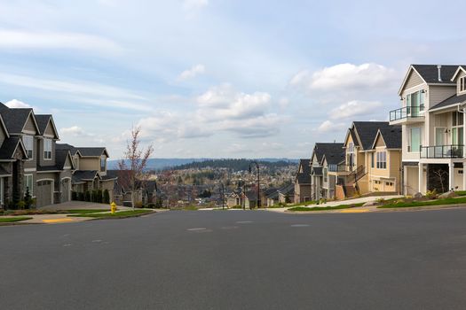 New North American suburban neighborhood upscale homes along street in Happy Valley Oregon United States