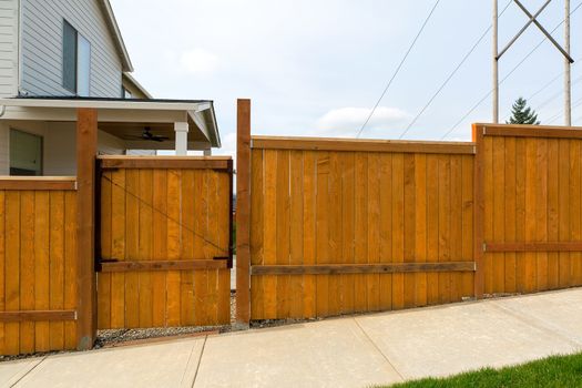 Home garden backyard cedar wood fence with gate door