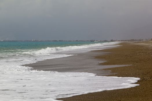 Soft wave of ocean on the sandy beach Antalya