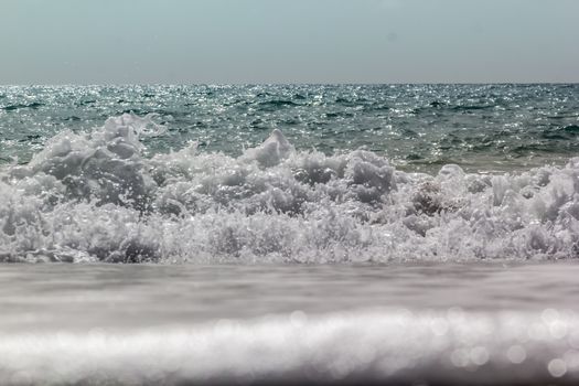Soft wave of ocean on the sandy beach Antalya