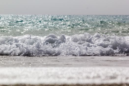 Soft wave of ocean on the sandy beach Antalya