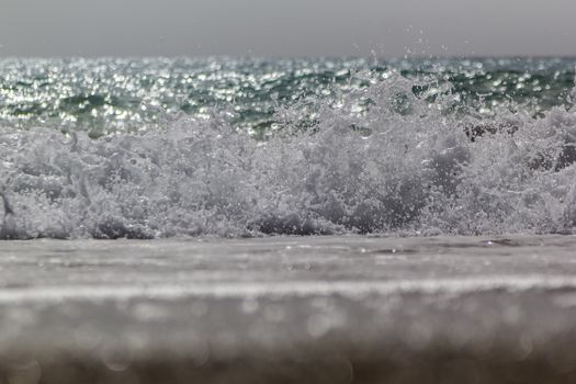 Soft wave of ocean on the sandy beach Antalya