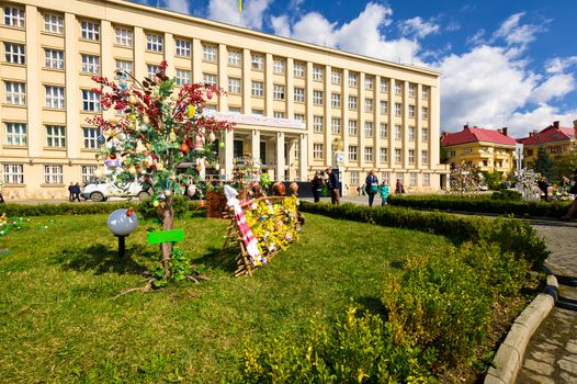 Uzhgorod, Ukraine - April 07, 2017: Celebrating Orthodox Easter in Uzhgorod on the Narodna square. Celebration in front of Transcarpathian Regional Administration building on a warm springtime day