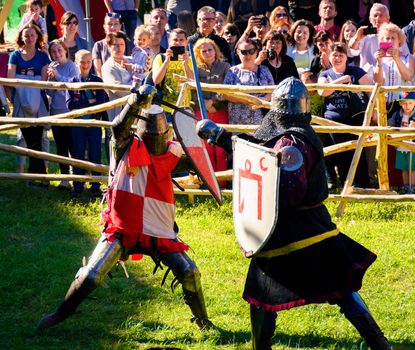 Chynadiyovo, Ukraine - May 27, 2017: medieval culture festival Silver Tatosh. Location St. Miklos Castle. Knight participants show their skills in fighting