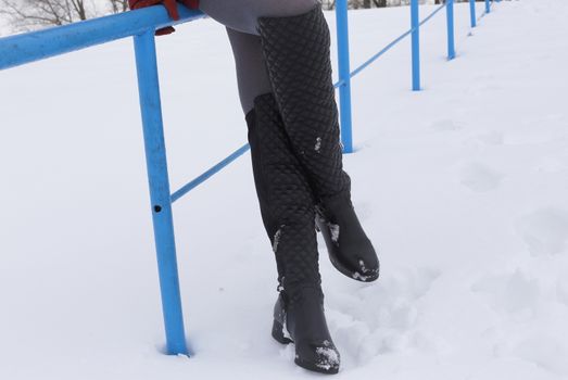 women's hands in gloves. keep snow and orange. white background, winter.