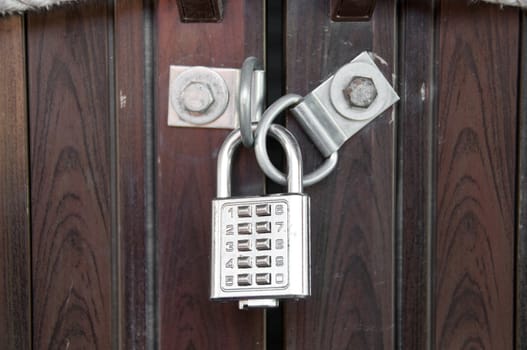 Silver numpad lock wooden door