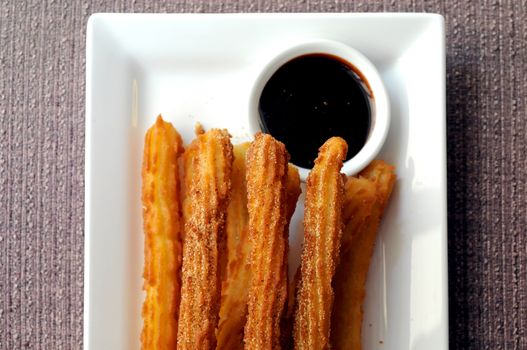 Spanish donut Churros with dark chocolate dipping sauce