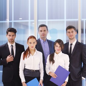 Portrait of business team of men and women indoors