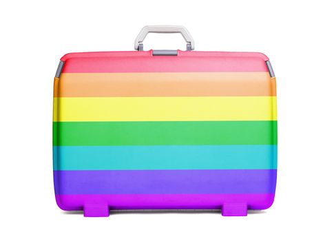 Used plastic suitcase with stains and scratches, printed with flag, rainbow flag