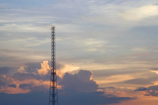 Mobile phone communication tower transmission  signal  leash in evening sky