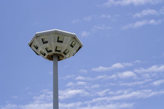  Lamp post of octagon it old have rusty with blue sky