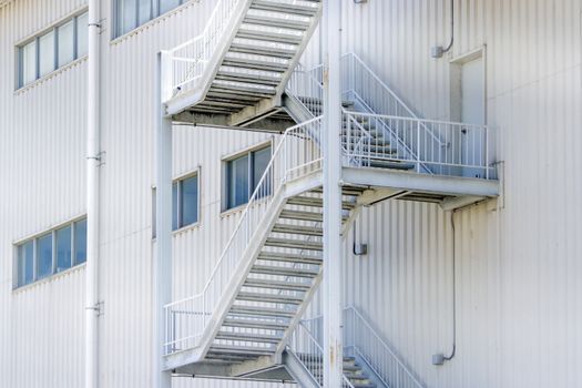 White iron staircase next to the building