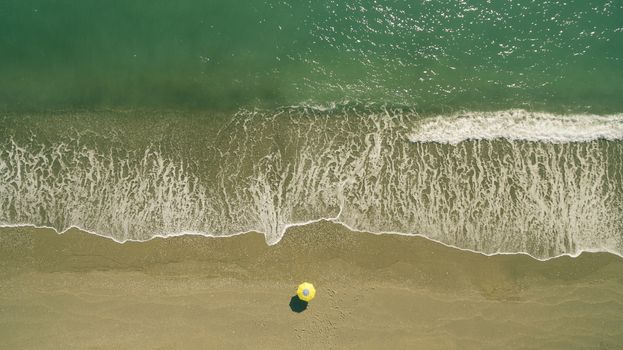 AERIAL: sunbathing on beach. No people only umbrella Antalya