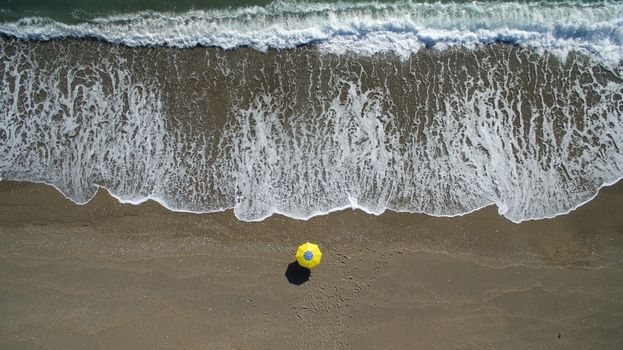 AERIAL: sunbathing on beach. No people only umbrella Antalya