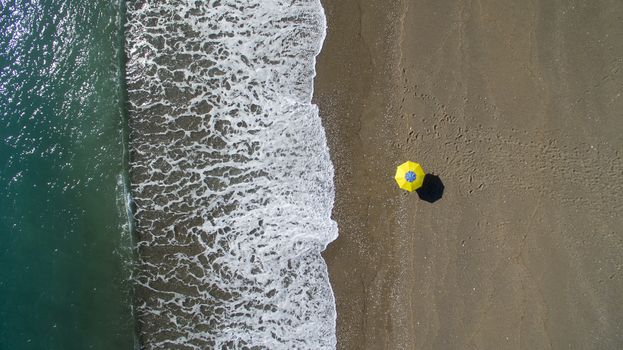 AERIAL: sunbathing on beach. No people only umbrella Antalya