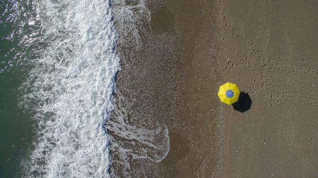 AERIAL: sunbathing on beach. No people only umbrella Antalya