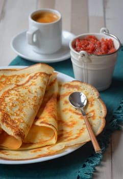 Breakfast with pancakes, jam and coffee